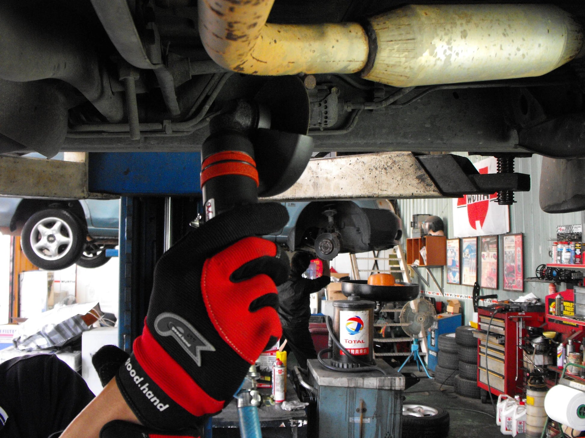 a mechanic working on a car in a garage