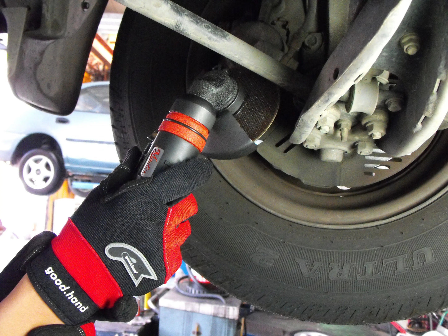 a person working on a tire with a wrench